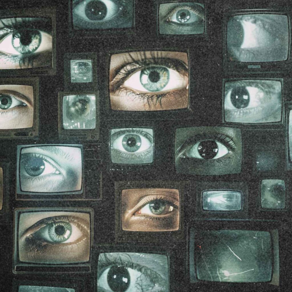 Foto mehrerer Monitore, auf denen jeweils ein einzelnes Auge in Nahaufnahme dargestellt ist.